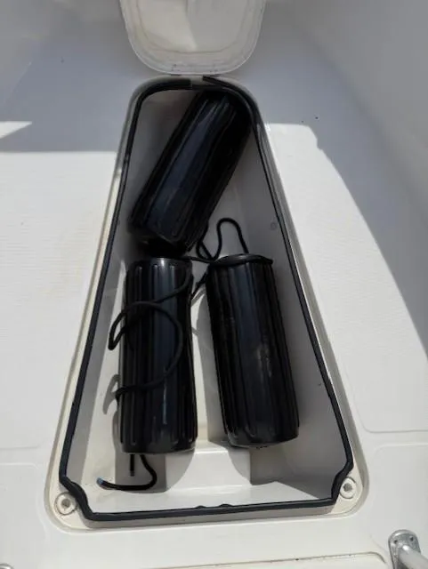 Slide: The Image of 2006 Angler 2600CC Limited Edition boat storage with black fenders. - 8