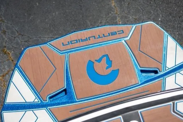 Slide: The Image of 2022 Centurion Ri265 boat deck with blue accents and logo design. - 22