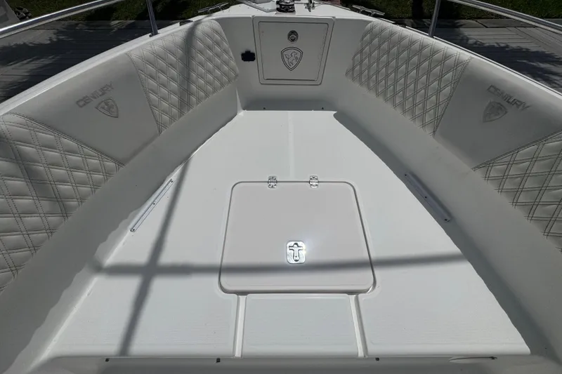 Slide: The Image of 2007 Century 2600CC boat interior with cushioned seating and storage compartment. - 17