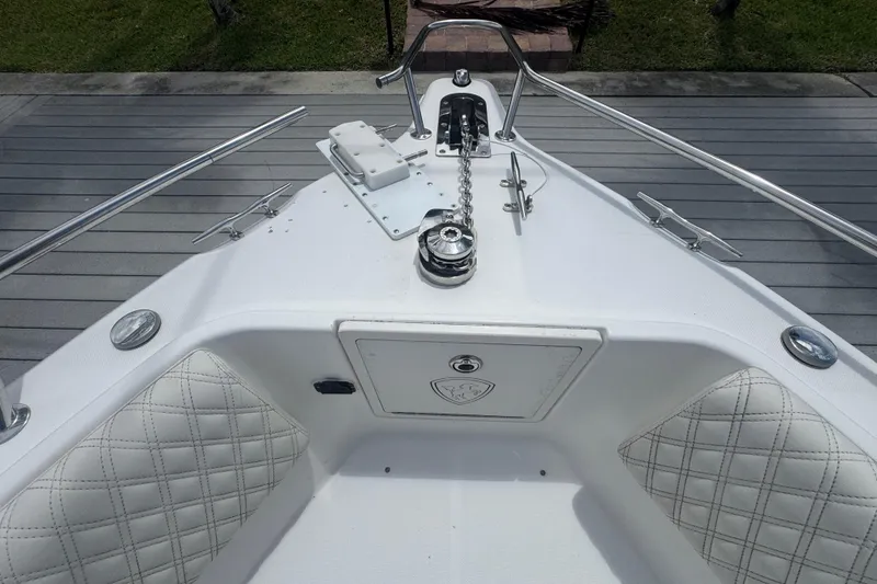 Slide: The Image of Bow of 2007 Century 2600CC boat with anchor chain and cushioned seating. - 18