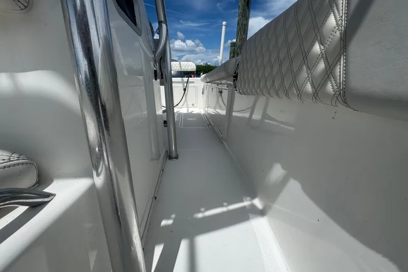 Slide: The Image of 2007 Century 2600CC boat interior with white seating and stainless steel railings. - 26