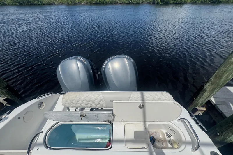 Slide: The Image of 2007 Century 2600CC boat with dual engines docked by the water. - 8