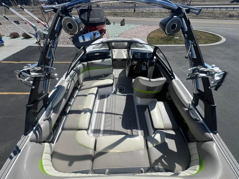 Slide: The Image of 2014 Malibu W22MXZ boat interior with spacious seating and modern design. - 11