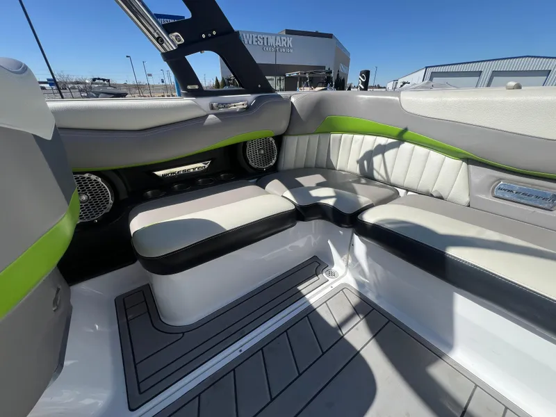 Slide: The Image of Interior of a 2014 Malibu W22MXZ boat with stylish seating and modern design. - 12