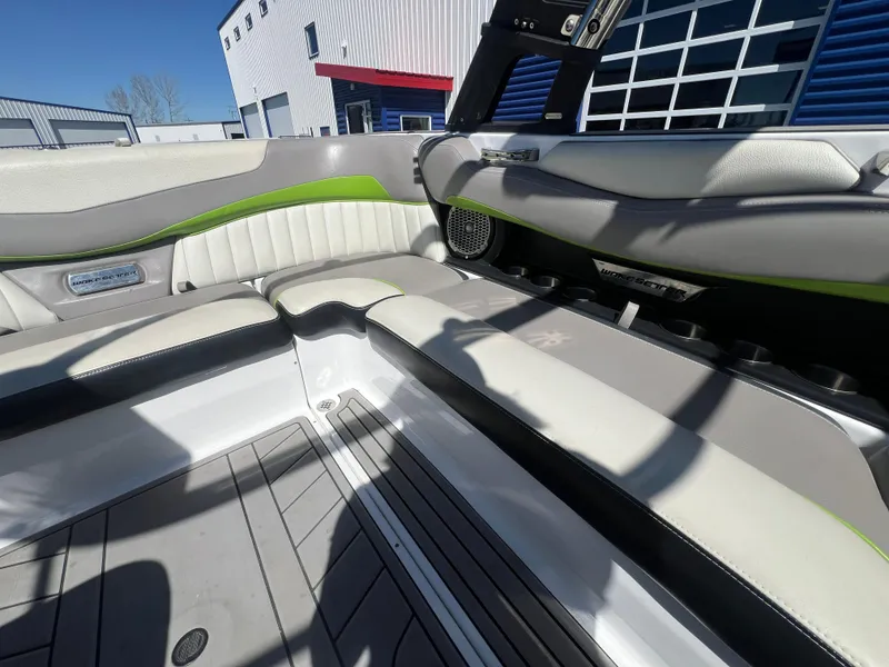 Slide: The Image of Interior of a 2014 Malibu W22MXZ boat with stylish seating and modern design. - 13
