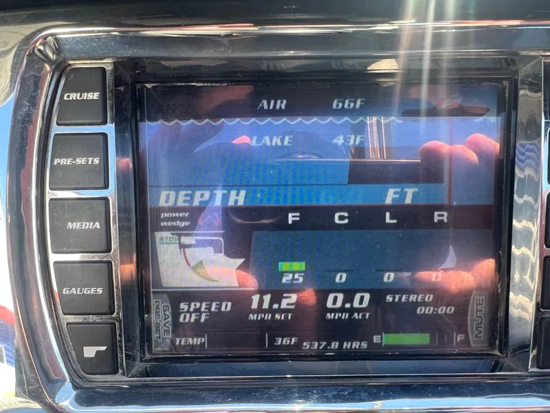Slide: The Image of Dashboard of a 2014 Malibu W22MXZ boat showing depth, speed, and temperature. - 20