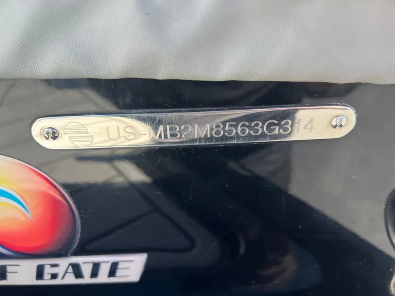 Slide: The Image of 2014 Malibu W22MXZ boat with visible hull identification number plate. - 21