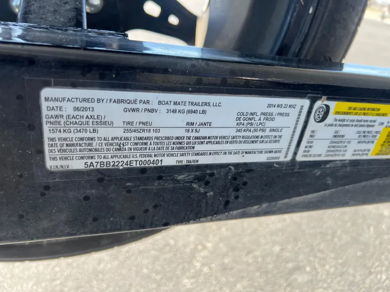 Slide: The Image of Label on Malibu W22MXZ 2014 trailer, detailing specifications and compliance information. - 22