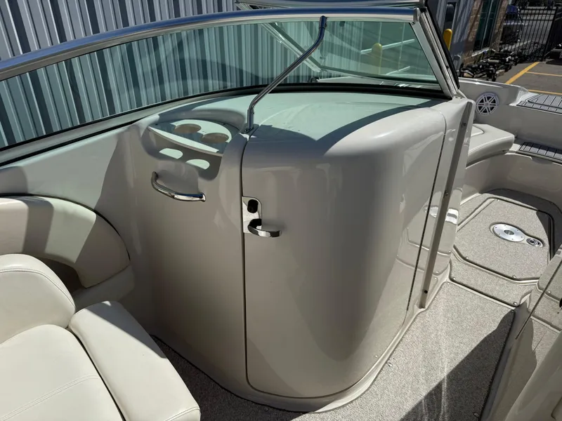 Slide: The Image of Interior of a 2008 Sea Ray 220 boat, featuring sleek design and comfortable seating. - 14