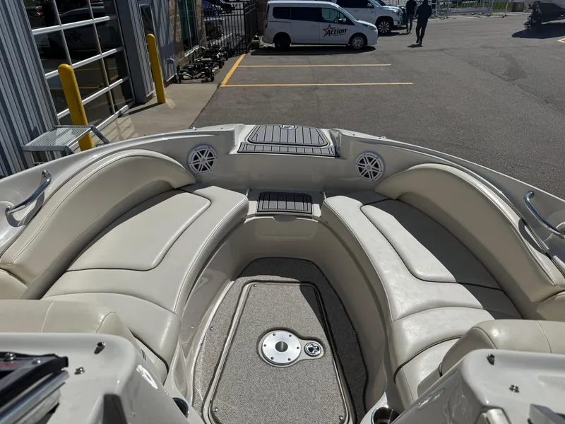 Slide: The Image of Interior view of a 2008 Sea Ray 220 boat with cushioned seating. - 21