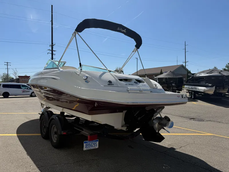 Slide: The Image of 2008 Sea Ray 220 boat on trailer in parking lot, sunny day. - 4