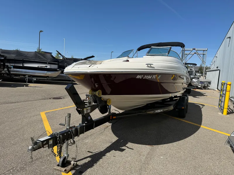 Slide: The Image of 2008 Sea Ray 220 boat on trailer in parking lot, sunny day. - 5