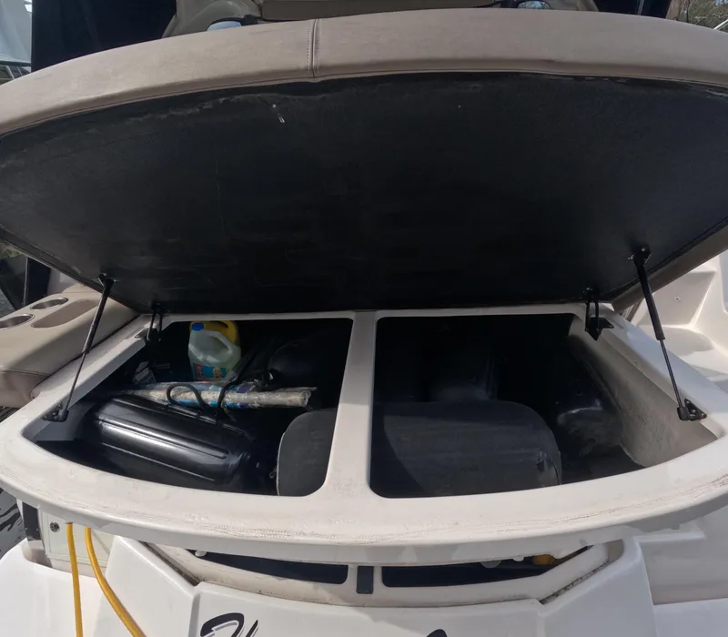 Slide: The Image of Open storage compartment on a 2015 Regal 35 Sport Coupe boat. - 37