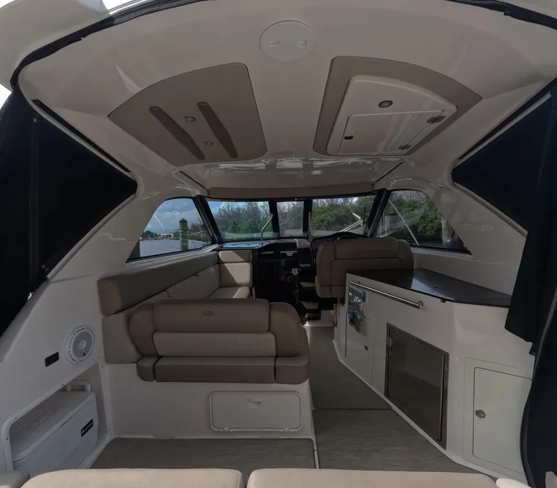 Slide: The Image of Interior of a 2015 Regal 35 Sport Coupe, featuring seating and modern amenities. - 41