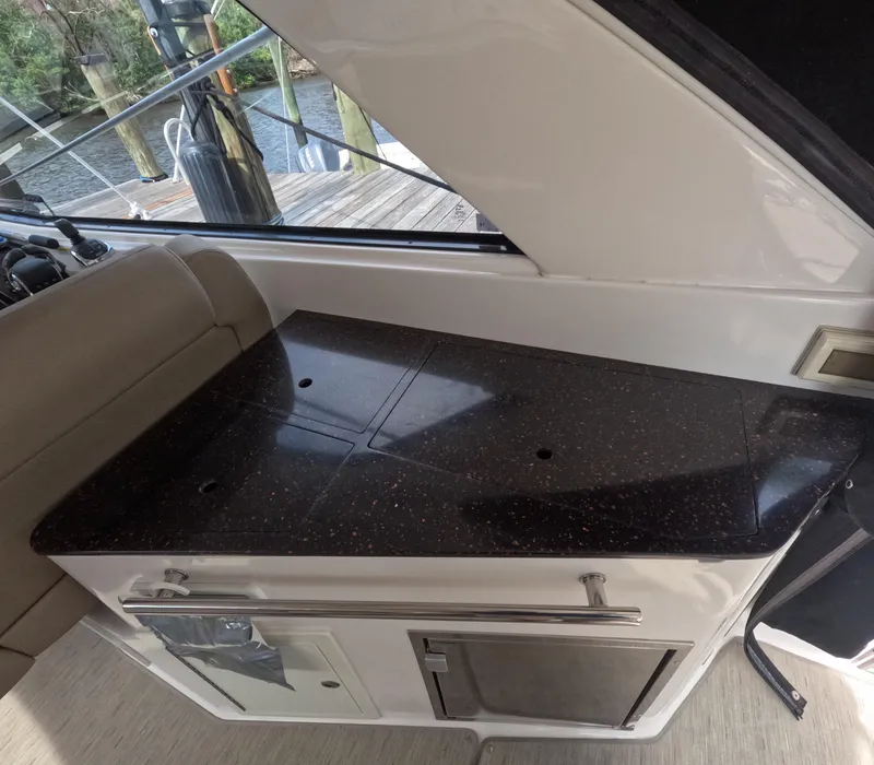 Slide: The Image of 2015 Regal 35 Sport Coupe interior with sleek countertop and cabinetry. - 44