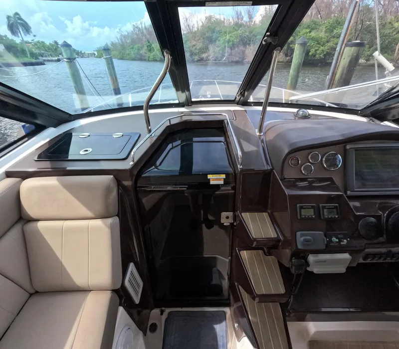Slide: The Image of 2015 Regal 35 Sport Coupe cockpit with modern controls and comfortable seating. - 47