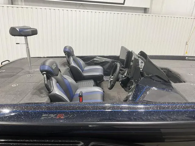 Slide: The Image of 2022 Skeeter FXR21 Select boat interior with dual seats and steering console. - 10