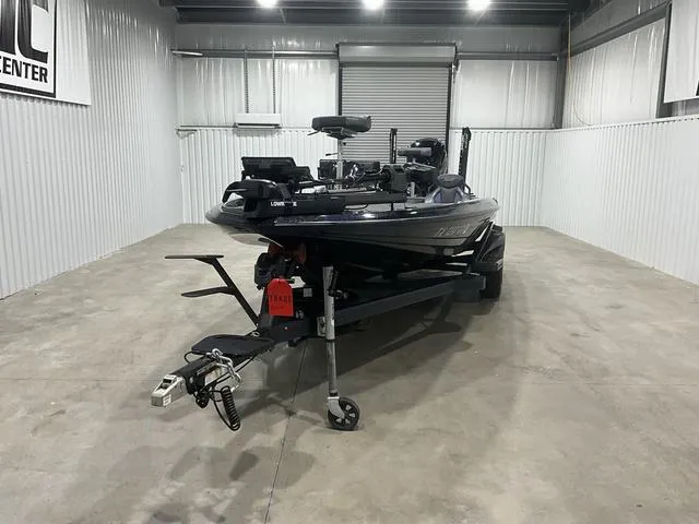 Slide: The Image of 2022 Skeeter FXR21 Select boat in a storage facility, front view. - 2