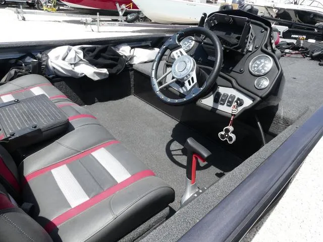 Slide: The Image of 2019 Ranger RT178C boat interior with steering wheel, dashboard, and seating. - 5