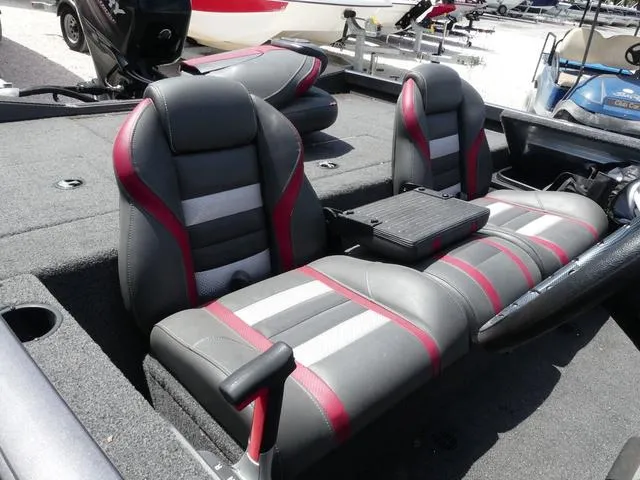 Slide: The Image of 2019 Ranger RT178C boat interior with gray and red seats, featuring a central console. - 6