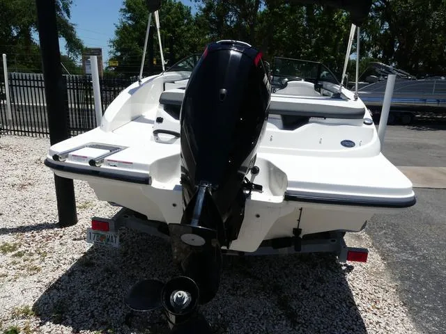 Slide: The Image of 2017 Sea Ray SPX 190 OB boat, rear view with outboard motor, parked on gravel. - 4