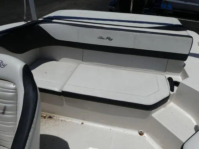 Slide: The Image of 2017 Sea Ray SPX 190 OB boat interior seating, white and black upholstery. - 9