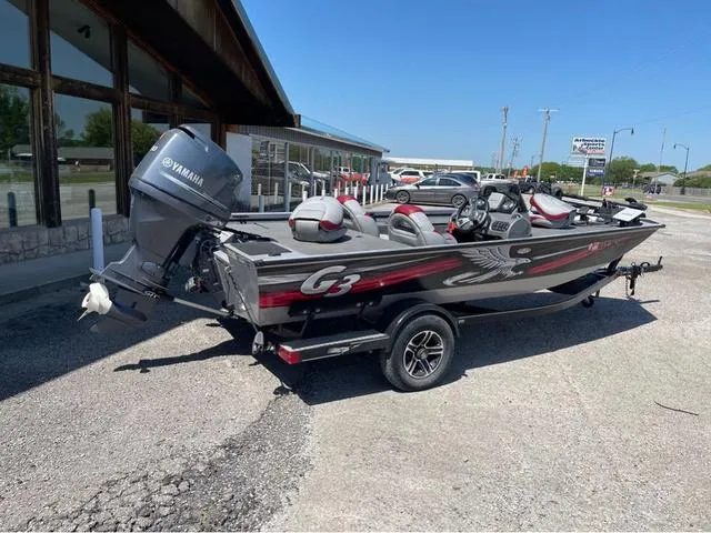 Slide: The Image of 2015 G3 Eagle Talon 17 DLX boat with Yamaha motor, parked outdoors on a sunny day. - 3