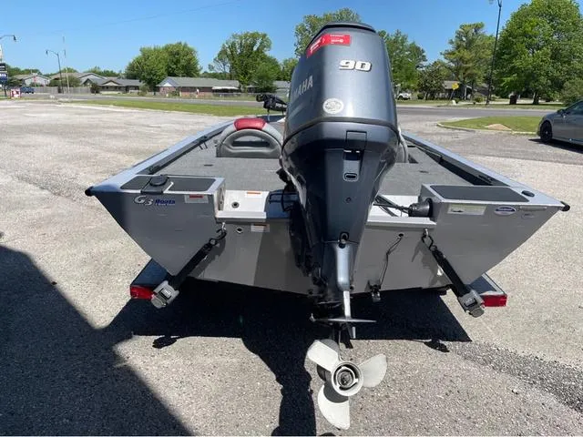 Slide: The Image of 2015 G3 Eagle Talon 17 DLX boat with Yamaha 90 engine, parked outdoors. - 5