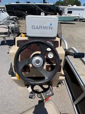 Slide: The Image of Steering console of a 2015 Sun Tracker 18 DLX with Garmin navigation system. - 8