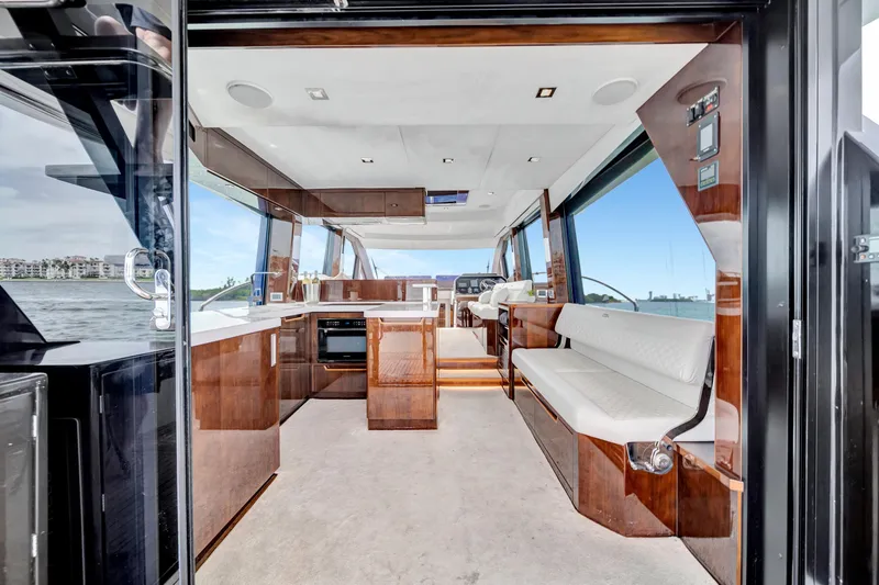 Slide: The Image of Luxurious interior of 2020 Galeon 500 Fly yacht with modern kitchen and seating area. - 10