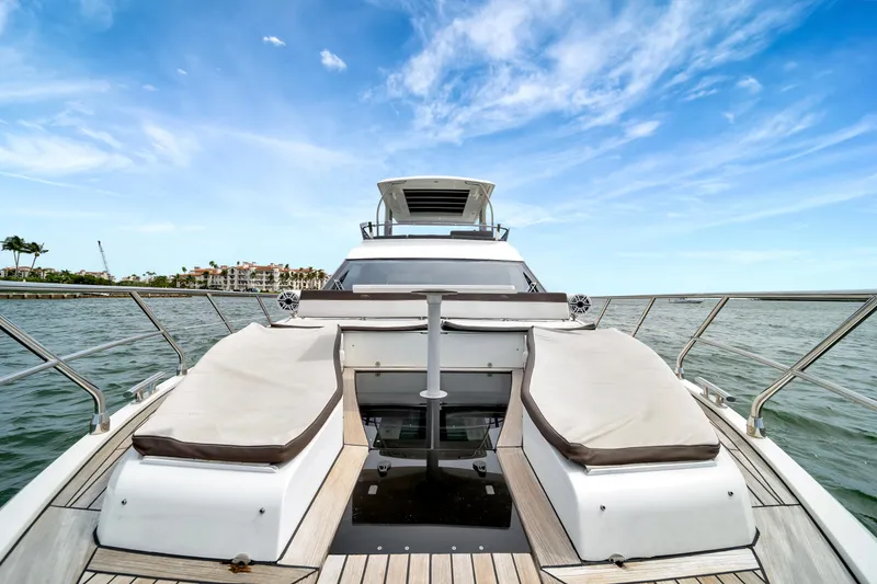 Slide: The Image of 2020 Galeon 500 Fly yacht deck with sun loungers on open water. - 3