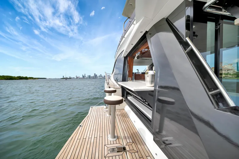 Slide: The Image of Galeon 500 Fly 2020 yacht with city skyline and ocean view. - 4