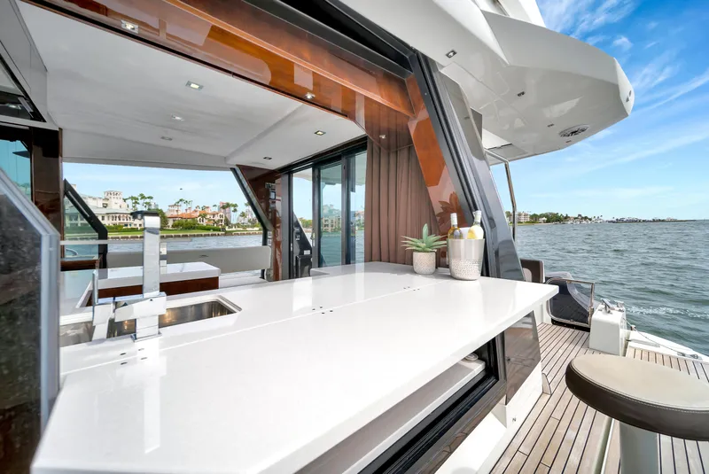 Slide: The Image of Luxurious 2020 Galeon 500 Fly yacht with sleek outdoor kitchen and ocean view. - 6
