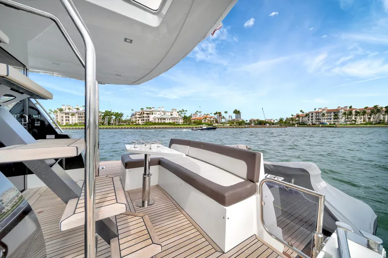 Slide: The Image of Luxurious 2020 Galeon 500 Fly yacht deck with scenic waterfront view. - 7