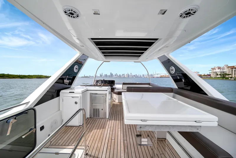 Slide: The Image of Luxury Galeon 500 Fly yacht interior with city skyline view, 2020 model. - 8