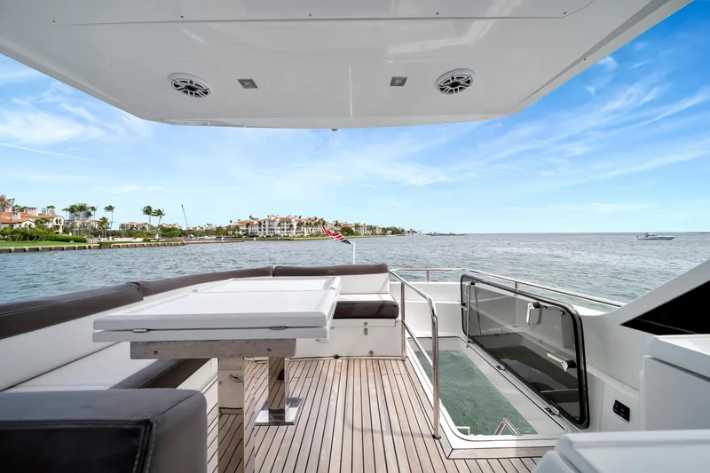 Slide: The Image of Luxurious 2020 Galeon 500 Fly yacht deck with ocean view and modern seating area. - 9