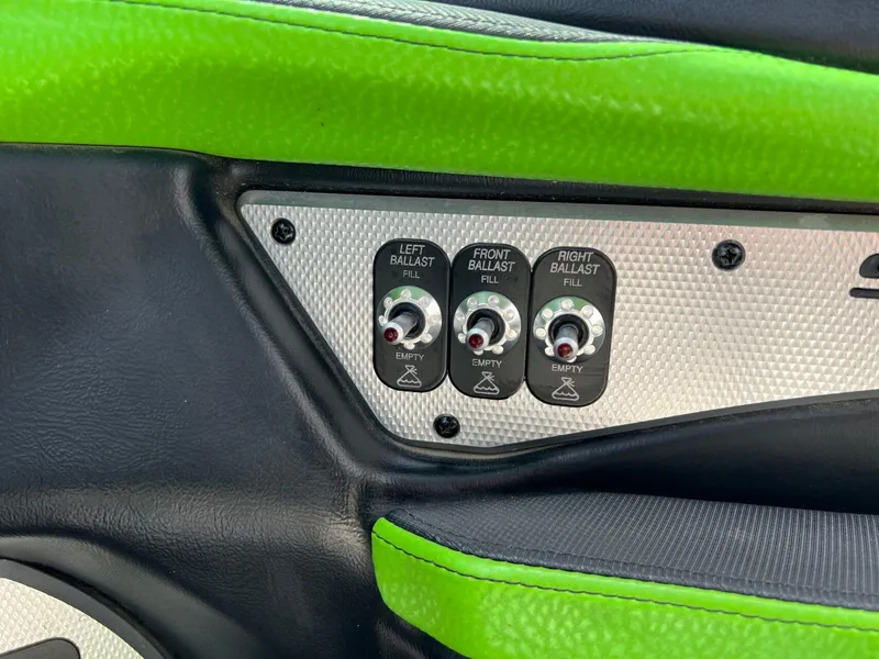 Slide: The Image of Control panel of a 2014 Supra SA450 boat with ballast fill switches. - 16