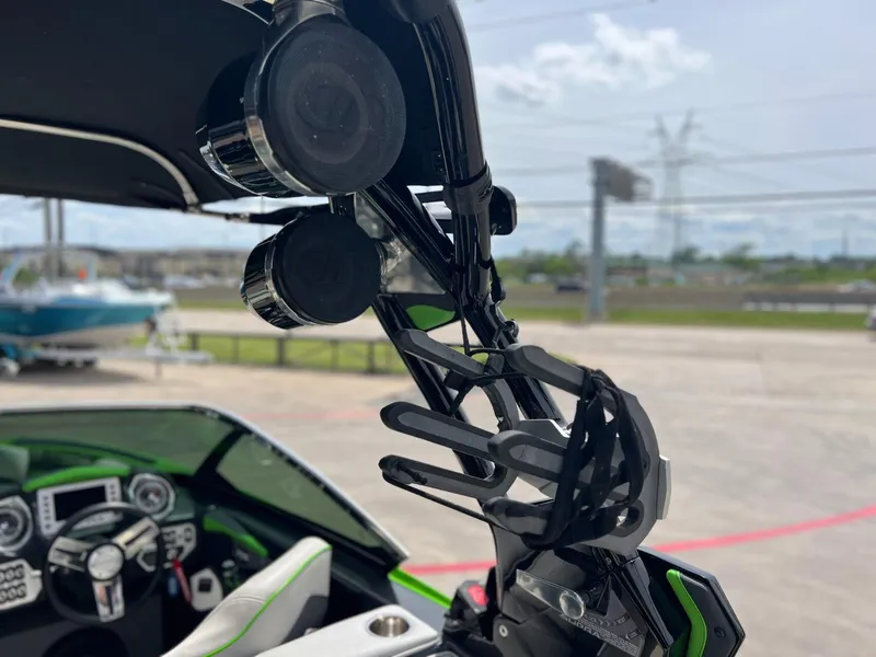 Slide: The Image of 2014 Supra SA450 boat interior with speakers and steering wheel, showcasing modern design features. - 19