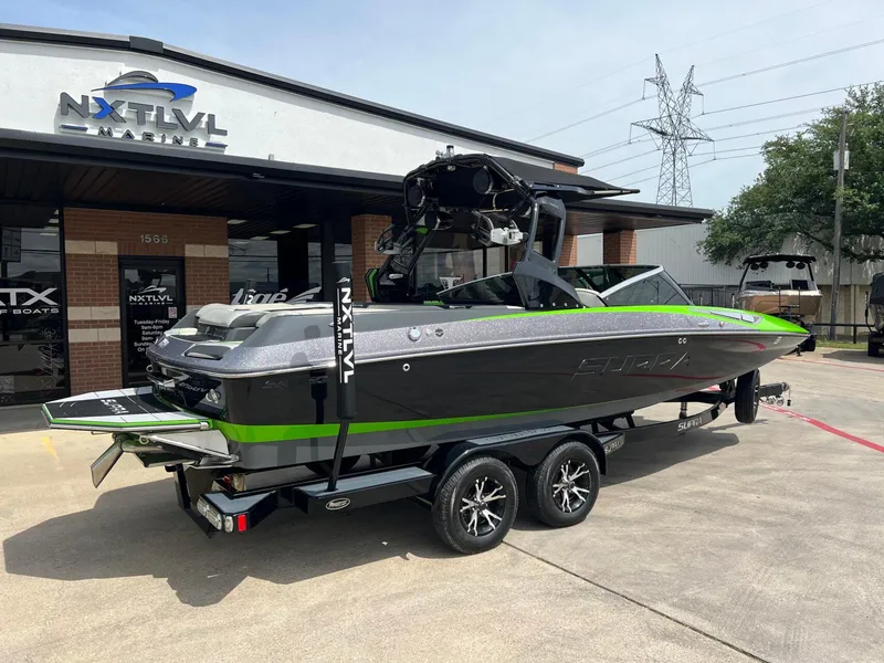Slide: The Image of 2014 Supra SA450 boat on trailer at NXT LVL Marine dealership. - 3