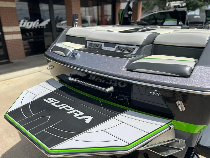 Slide: The Image of 2014 Supra SA450 boat rear view with branded swim platform and seating. - 4