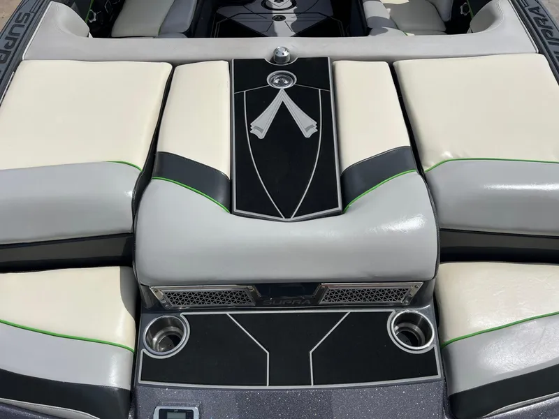Slide: The Image of Interior of 2014 Supra SA450 boat with stylish seating and cup holders. - 5