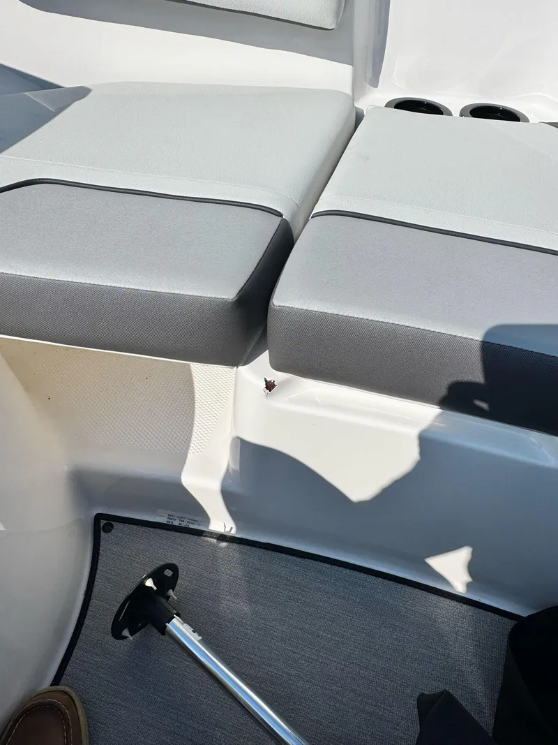 Slide: The Image of 2008 Chaparral Sunesta 284 boat interior with gray seating and deck details. - 15