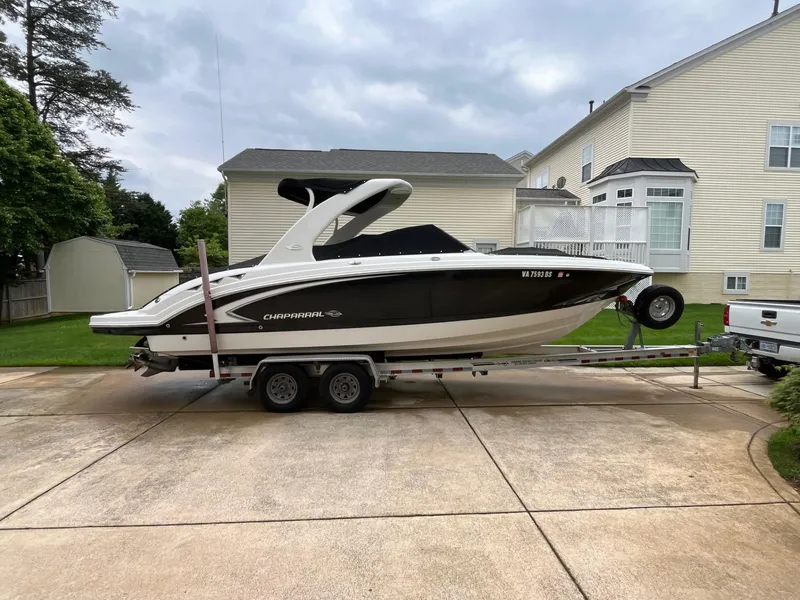 Slide: The Image of 2009 Chaparral Sunesta 284 boat on trailer in residential driveway. - 4