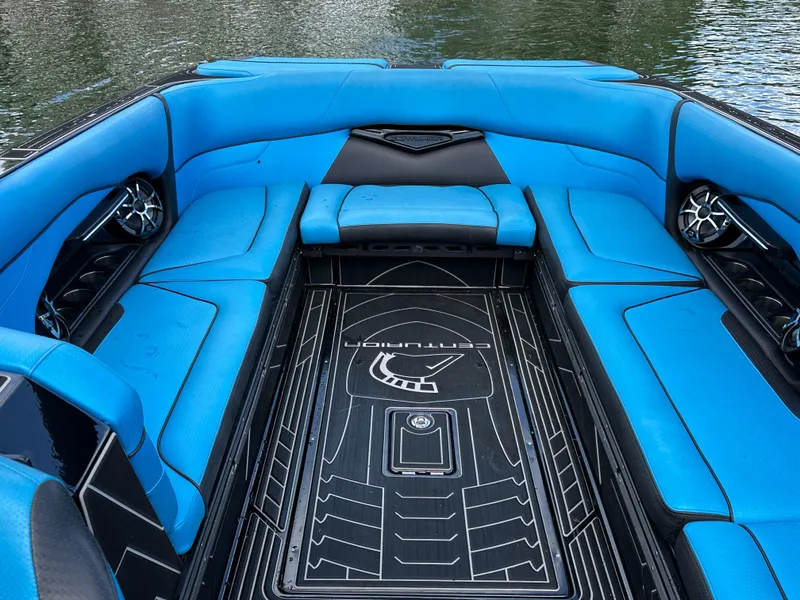 Slide: The Image of 2019 Centurion Ri257 boat interior with blue seating and sleek design. - 14