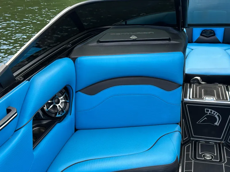 Slide: The Image of 2019 Centurion Ri257 boat interior with blue seating and sleek design. - 8