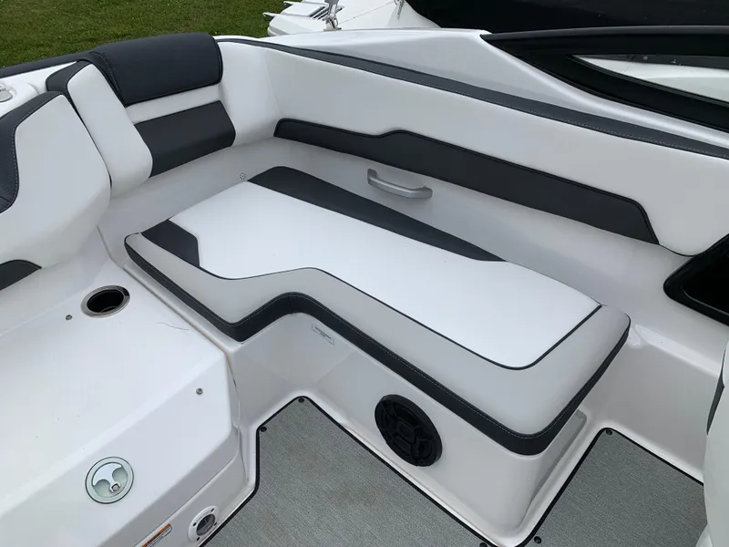 Slide: The Image of 2023 Yamaha Boats SX195 interior seating with sleek white and black design. - 26