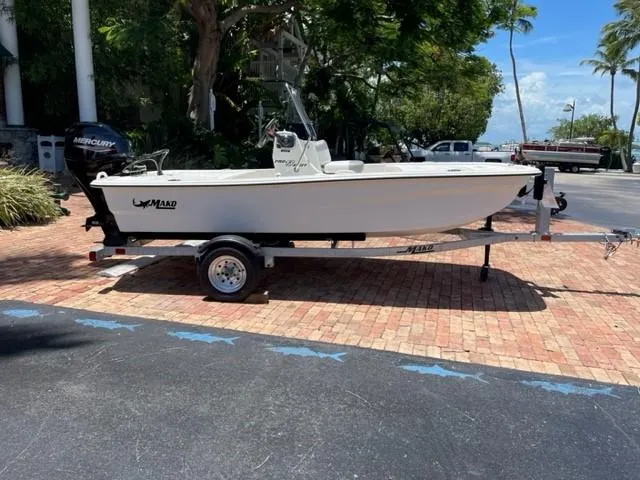 The Image of 2025 Mako Pro Skiff 13 CC boat on trailer with Mercury outboard motor. - 0