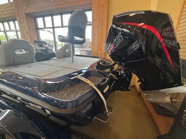 Slide: The Image of 2025 Nitro Z21 XL boat with powerful outboard motor in showroom display. - 7