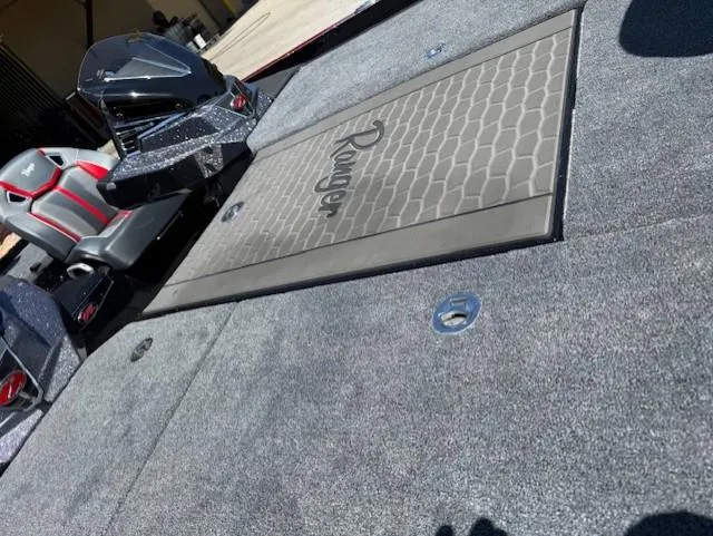 Slide: The Image of 2025 Ranger Z521R boat interior with sleek seating and textured flooring. - 11