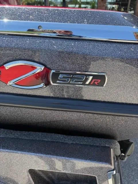 Slide: The Image of 2025 Ranger Z521R boat emblem with metallic finish. - 2